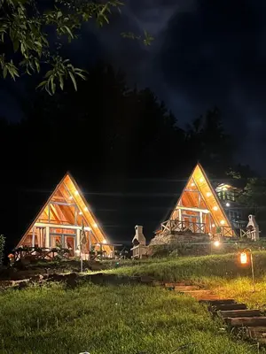 a house at night with the lights on at Vikendica - Rajski Poluotok in Jajce