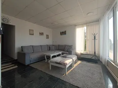 a living room with a couch and a table at Mountain Relax Vlašić in Vlasic