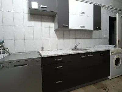 a kitchen with a sink and a washing machine at Mountain Relax Vlašić in Vlasic
