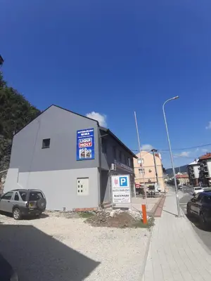 a building with a car parked in front of it at stari grad in Doboj