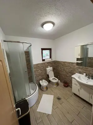 a bathroom with a shower and a toilet and a sink at stari grad in Doboj