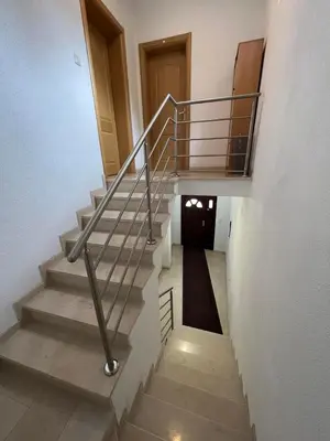 a staircase with a metal railing in a building at stari grad in Doboj