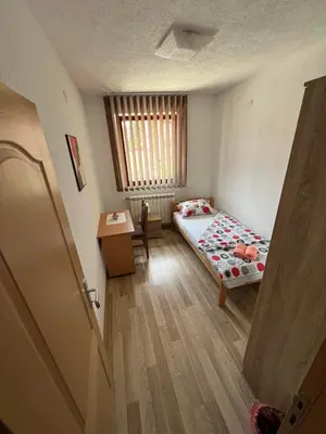 a small room with a bed and a window at stari grad in Doboj