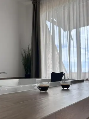 two bowls of food on a counter in front of a window at Zemunice Knezevic in Banja Luka
