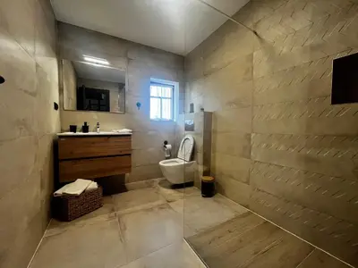 a bathroom with a toilet and a sink at Farm Stay Čardaklije in Kulen Vakuf
