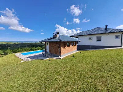 a house on a hill with a swimming pool at Vikendica sa bazenom Staša in Banja Luka