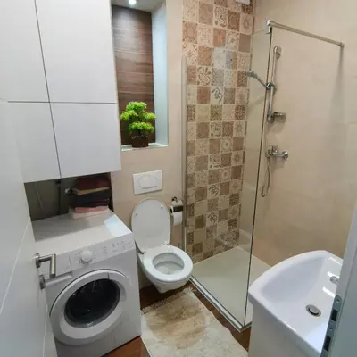 a bathroom with a toilet and a shower and a sink at APARTMAN KRPELJ Banja Luka in Budžak