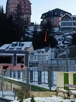 a building with a red arrow on top of it at Mountain Apartment Vlašić Babanovac in Vlasic