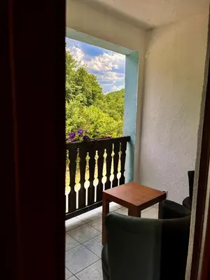 a view of a balcony with a table and a window at Kuća za odmor Bilić in Sopot
