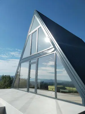a glass house with a roof with windows at Villa Vista in Banja Luka