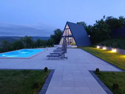 a pyramid house on a hill with a swimming pool at Villa Vista in Banja Luka