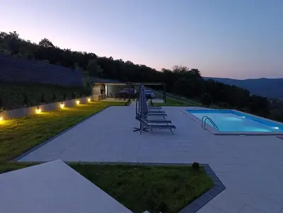 a backyard with a swimming pool and a swimming pool at Villa Vista in Banja Luka