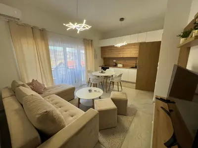 a living room with a couch and a table at Apartment Magnolia in Banja Luka