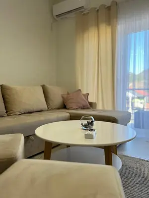 a living room with a couch and a table at Apartment Magnolia in Banja Luka