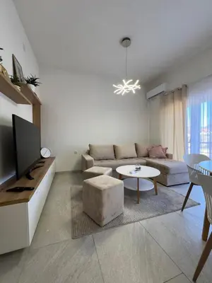 a living room with a couch and a table at Apartment Magnolia in Banja Luka