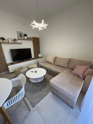 a living room with a couch and a table at Apartment Magnolia in Banja Luka