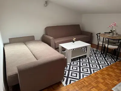 a living room with a couch and a table at Apartment Star in Jajce