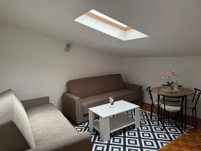 a living room with a couch and a table at Apartment Star in Jajce