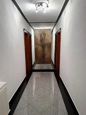 an empty hallway with a painting on the wall at Deutsches Haus Livno in Livno