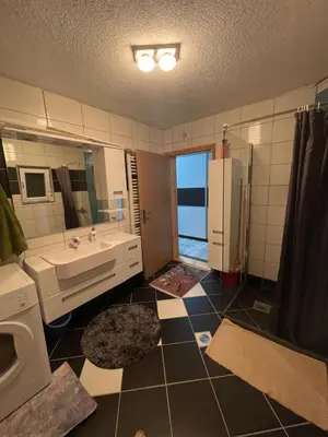 a bathroom with a sink and a toilet and a mirror at Villa ADA in Jajce