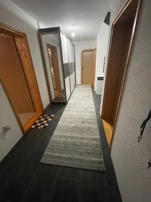 a hallway with doors and a carpet on the floor at Villa ADA in Jajce