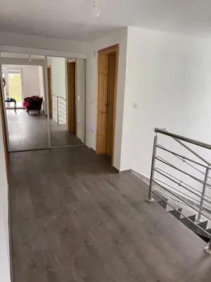 an empty room with a staircase and a living room at Villa ADA in Jajce