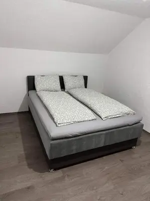 a bed in a room with two pillows on it at Villa ADA in Jajce