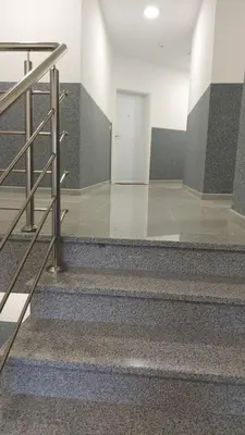 a staircase in a building with a stair case at Apartman Centar Kozarska Dubica in Bosanska Dubica
