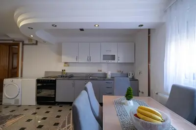 a kitchen with a table with bananas on it at GOOD People in Bihać