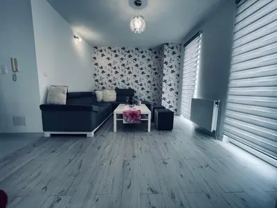 a living room with a couch and a table at Stan 7 in Kiseljak
