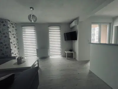 a living room with a couch and a tv at Stan 7 in Kiseljak