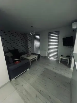 a living room with a couch and a tv at Stan 7 in Kiseljak