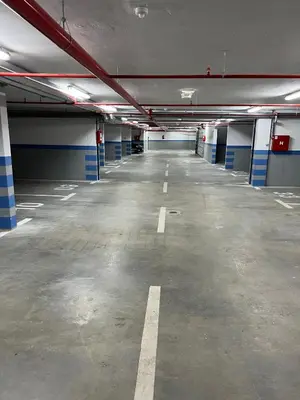 an empty parking lot in a parking garage at Apartman EMA in Banja Luka