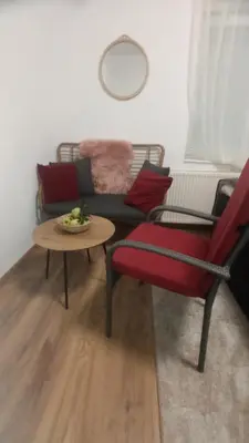 a living room with a couch and a table at 7 Kućica in Livno