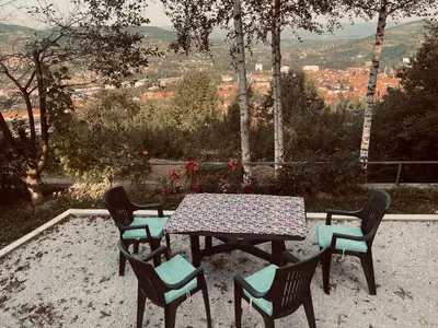 a table and chairs with a view of a city at Vikendica VIDIKOVAC na Piramidi Sunca in Visoko