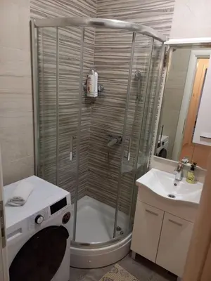 a bathroom with a shower and a sink at Apartman RedBrick in Banja Luka