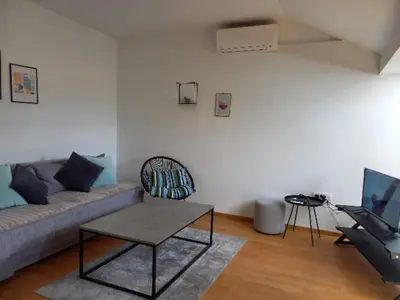 a living room with a couch and a table at Apartman RedBrick in Banja Luka