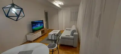 a living room with a couch and a tv at Apartmani ANNA in Banja Luka
