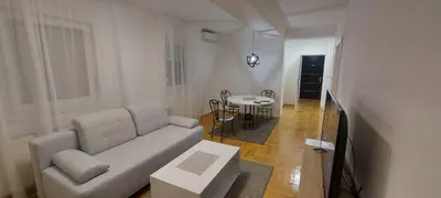 a living room with a couch and a table at Apartmani ANNA in Banja Luka