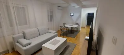 a living room with a couch and a table at Apartmani ANNA in Banja Luka