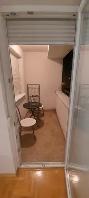 a view of a room with a table and a chair at Apartmani ANNA in Banja Luka