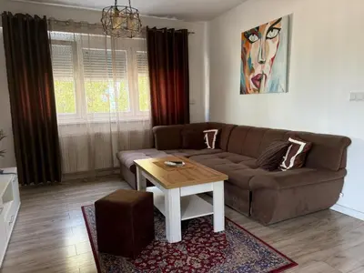 a living room with a couch and a table at Apartman VIVA in Bihać