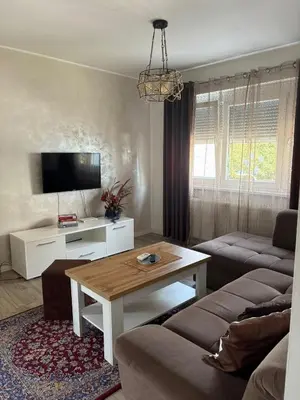 a living room with a couch and a table at Apartman VIVA in Bihać