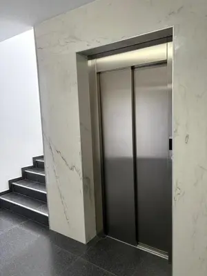a elevator in a building with a staircase at Apartman VIVA in Bihać