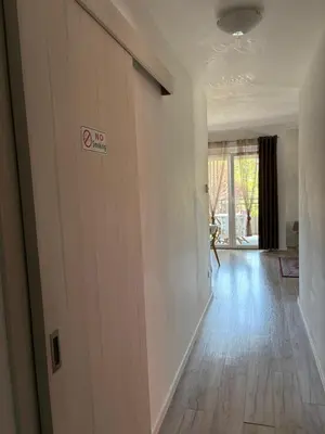 a hallway with a no smoking sign on a wall at Apartman VIVA in Bihać