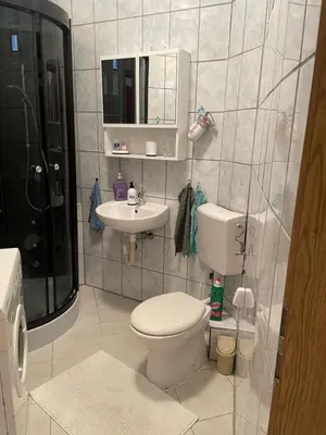 a bathroom with a toilet and a sink at Anna in Livno