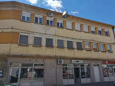 an old building on the corner of a street at Anna in Livno