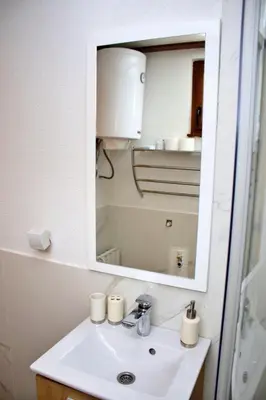 a bathroom with a sink and a mirror at Eko kuca Jandro in Šipovo