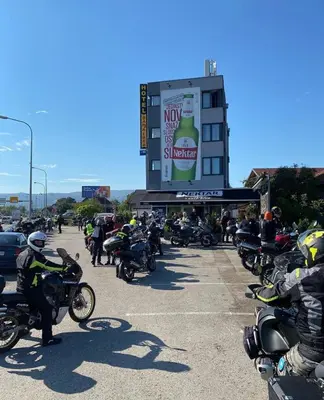a large group of motorcycles parked in a parking lot at Hotel Banja Luka in Banja Luka