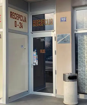a building with a revolving door with a sign on it at Hotel Banja Luka in Banja Luka